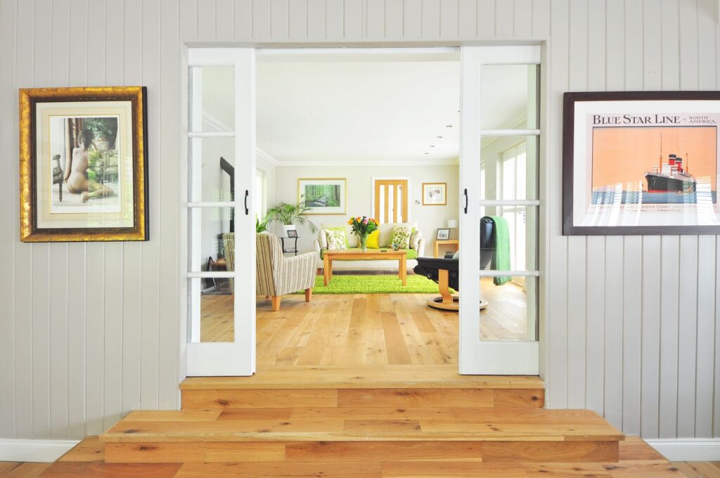 Green area rug under a wooden coffee table